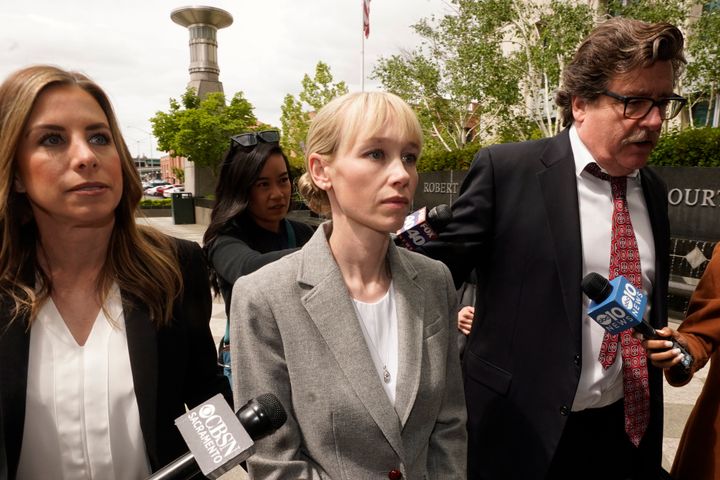 Sherri Papini of Redding, California, walks to a federal courthouse in Sacramento with her attorney in April. She was sentenced Monday to 18 months in prison.