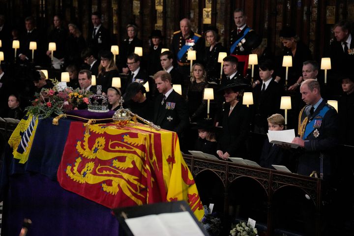 The Queen's coffin in front of her family members, just before it was lowered into the royal vault during the committal service.