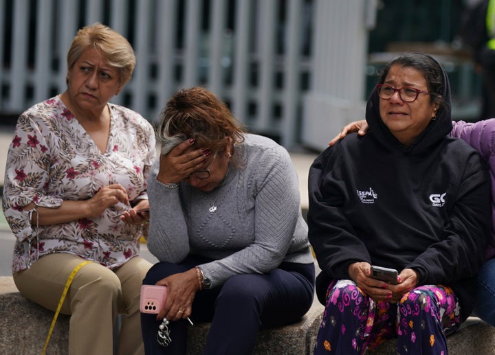 People gather outside after a magnitude 7.6 earthquake was felt in Mexico City, Monday, Sept. 19, 2022. (AP Photo/Fernando Llano)