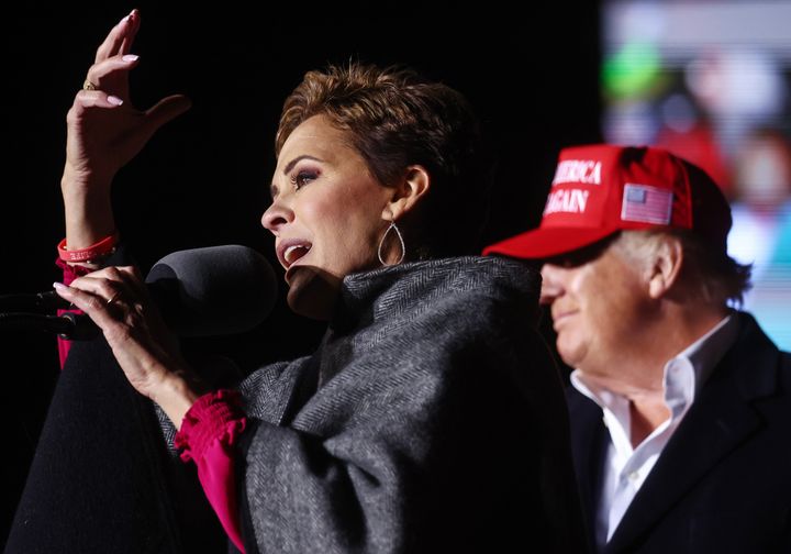 Kari Lake, a Republican candidate for Arizona governor, speaks as former President Donald Trump looks on at a rally on Jan. 15 in Florence, Arizona.