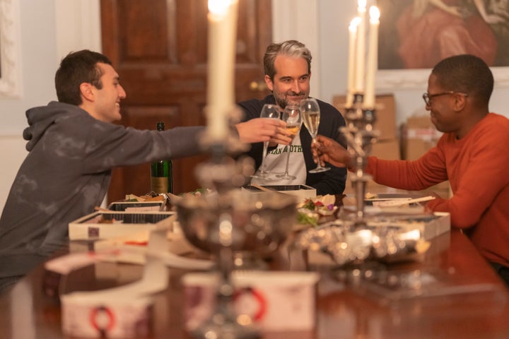 After Gus (right) uses his connections to get Leo Bloom (Sonny Poon Tip, left) into Oxford, he celebrates with Leo and Jesse (Jay Duplass, center).