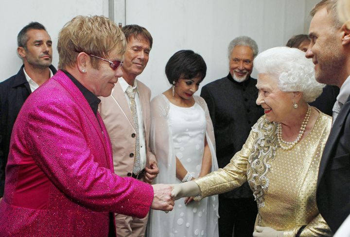 Queen Elizabeth II meeting Sir Elton John backstage at The Diamond Jubilee Concert outside Buckingham Palace in 2012