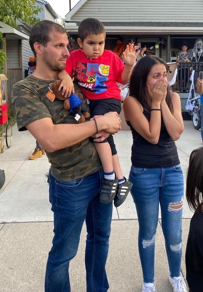 Alex's parents Nick (left) and Kira (right) were overwhelmed by the parade.