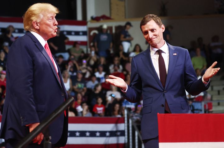 Former President Donald Trump (left) stands with Republican Senate campaigner  Blake Masters astatine  a "Save America" rally successful  enactment    of Arizona GOP candidates connected  July 22 successful  Prescott Valley, Arizona.