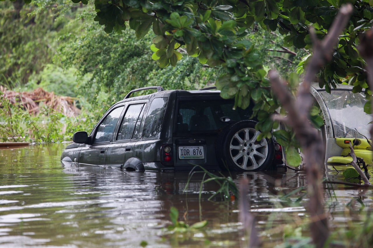 A car was submerged in Salinas, Puerto Rico, on Monday.