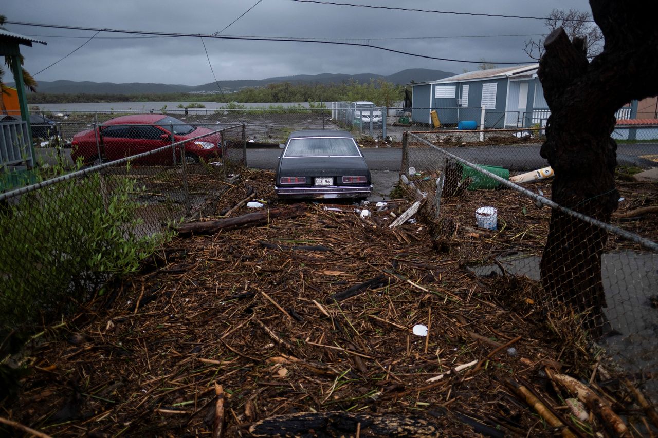 Debris covers the entrance of a house Monday in Guayanilla, Puerto Rico.