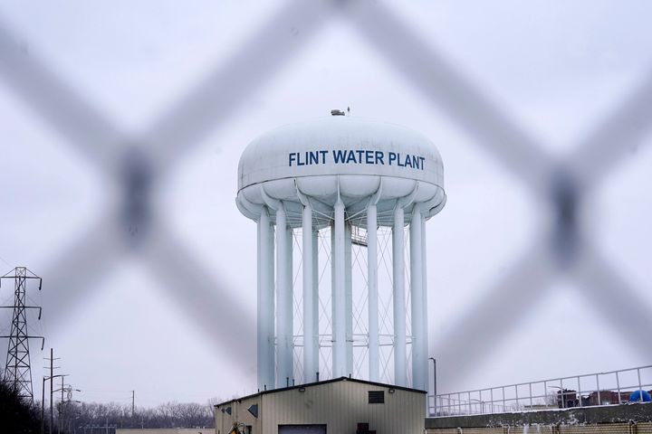 FILE - The Flint Water Plant tower is seen on January 6, 2022 in Flint, Michigan.  Residents of the mostly black city were exposed to lead after the city used water from the Flint River and failed to treat it to reduce the corrosive effect of old pipes.