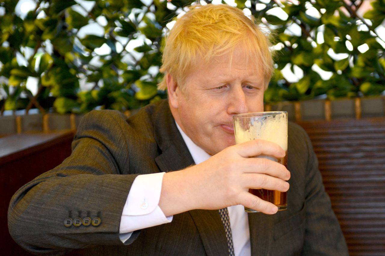 Boris Johnson sips a pint of beer in Wolverhampton.