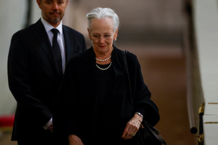 Denmark's Queen Margrethe pays her respect to the coffin of Britain's Queen Elizabeth, following her death, during her lying-in-state at Westminster Hall, in London, Sunday Sept. 18, 2022. (John Sibley/Pool via AP)