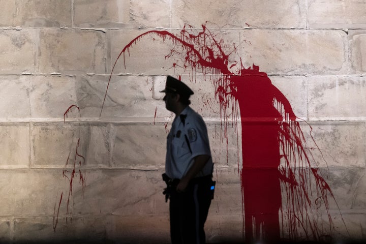 A splash of blood-red paint on the Washington Monument