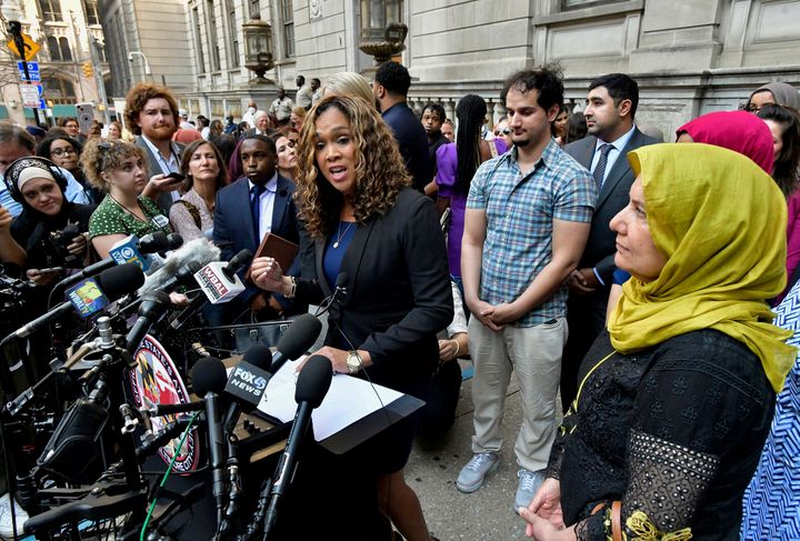 State’s Attorney Marilyn Mosby (left) discusses the release of Adnan Syed after his conviction was overturned on Monday. Syed's mother, Shamim Syed (right), looks on with another son, standing behind Mosby.