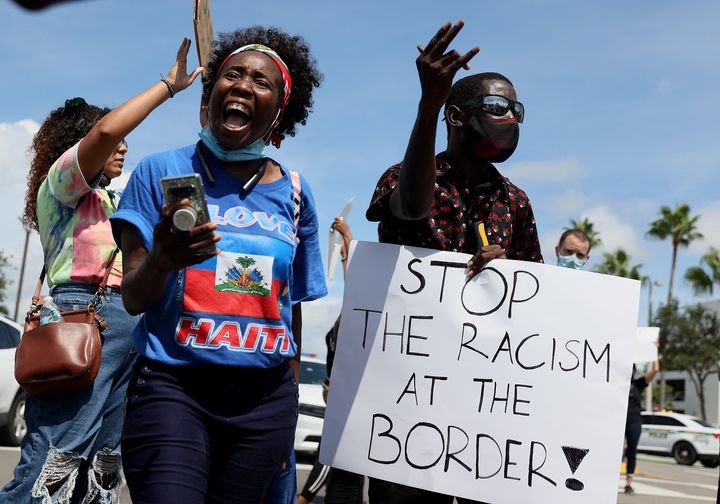 Protesters at a U.S. Citizenship and Immigration Services building in Miami last year denounce the expulsion of Haitian refugees from Del Rio, Texas.