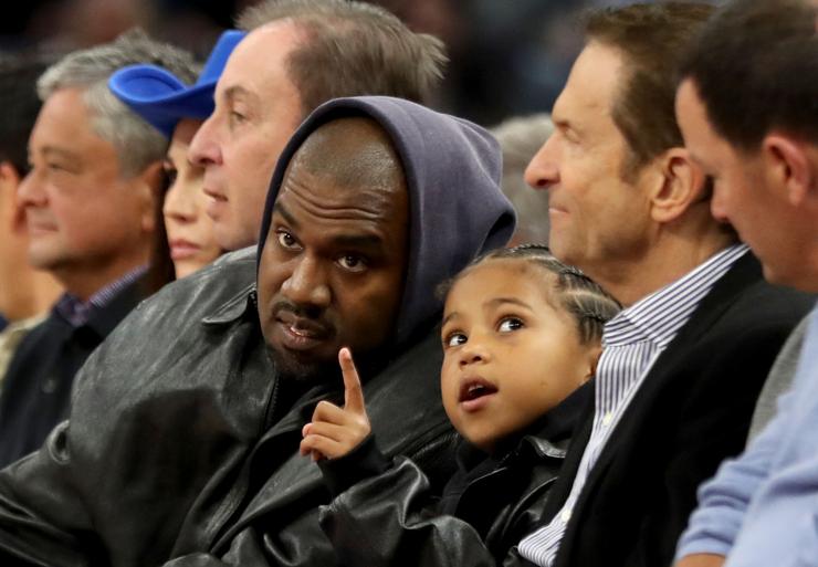 Kanye West takes his son Saint to a Golden State Warriors game against the Boston Celtics in March in San Francisco.