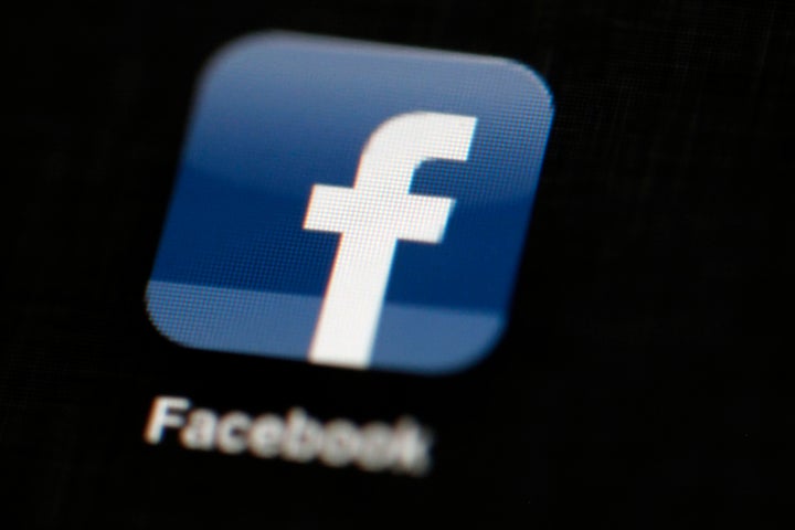 FILE - The Facebook logo is displayed on an iPad in Philadelphia, May 16, 2012. Actions by Facebook and its parent Meta during last year's Gaza war violated the rights of Palestinian users to freedom of expression, freedom of assembly, political participation and non-discrimination, a report commissioned by the social media company has found. (AP Photo/Matt Rourke, File)