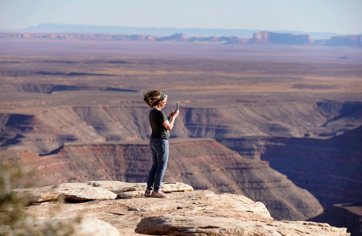 A visitor photographs a vista at Bears Ears National Monument on April 4, 2021, outside Blanding, Utah.