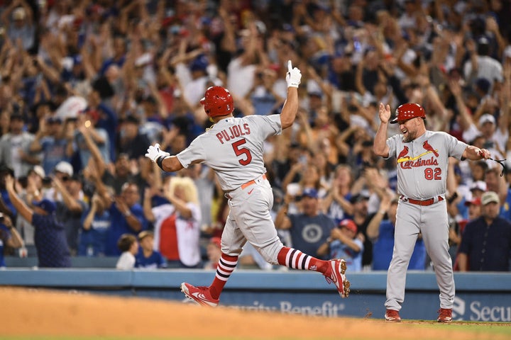 St. Louis Cardinals designated hitter Albert Pujols (5) circles the bases after his700th career home run on Friday.
