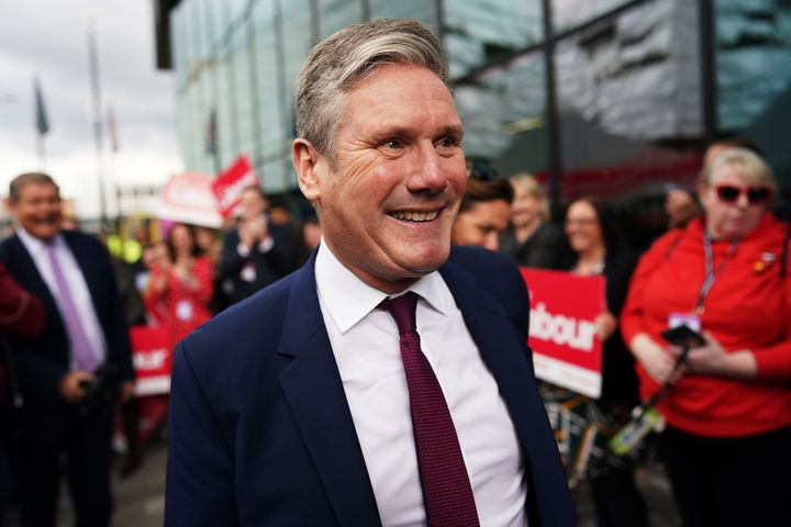 Keir Starmer is greeted by Labour activists as he arrives at the Pullman Hotel ahead of Labour's annual party conference.