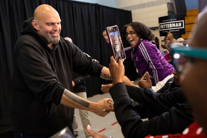 Pennsylvania Lt. Gov. John Fetterman, now the Democratic nominee for U.S. Senate, greets supporters as he enters his first rally in Philadelphia on Saturday.