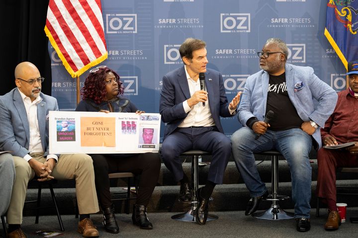 Mehmet Oz (second from right), the Republican Senate nominee, speaks at a roundtable on gun violence in northwest Philadelphia on Monday. State Rep. Chris Rabb, a Democrat and Fetterman supporter, is seated at left.