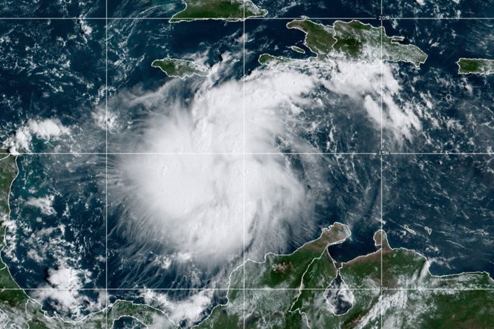 Ian, seen in a satellite photo over the central Caribbean on Saturday, is expected to become a hurricane by early Monday and reach major hurricane strength Monday night or early Tuesday.