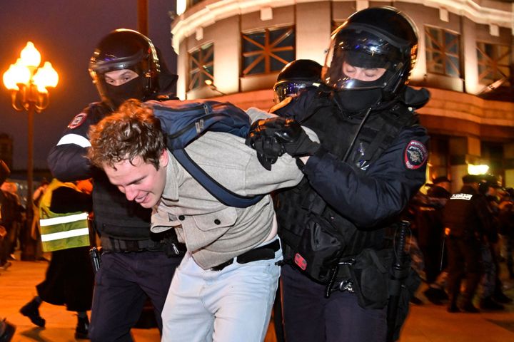 Police detain a man in Moscow on September 21 following calls to protest against partial mobilisation.