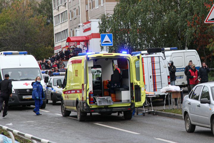 Police and paramedics work at the scene of a shooting at school No. 88 in Izhevsk, Russia, on Sept. 26, 2022. 