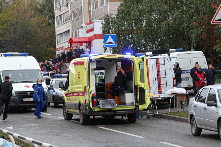 Police and paramedics work at the scene of a shooting at school No. 88 in Izhevsk, Russia, on Sept. 26, 2022.