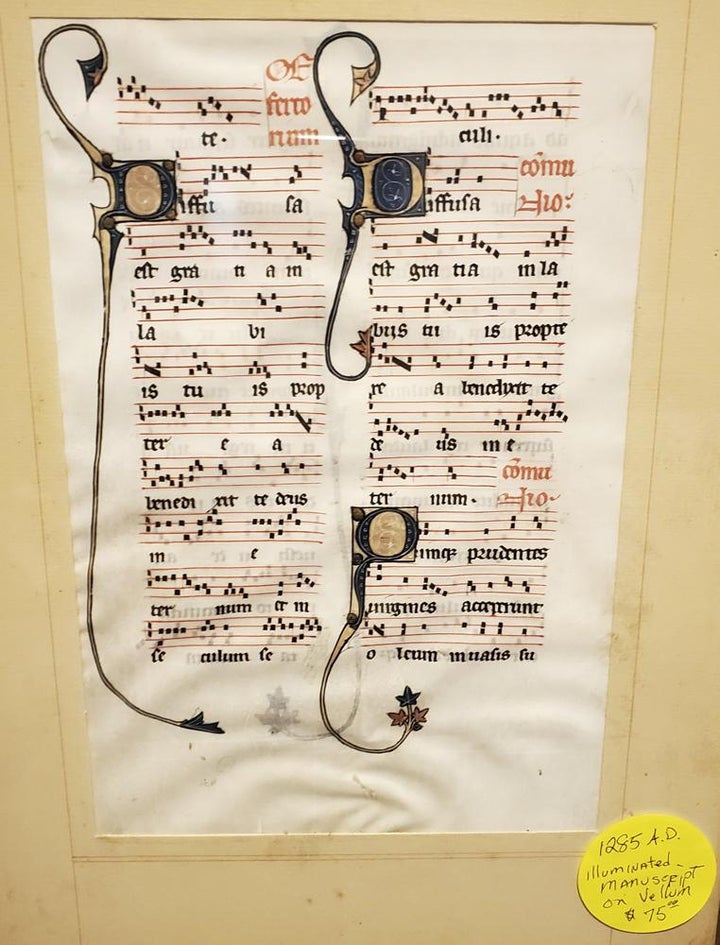 This photo provided by Will Sideri shows a 700-year-old manuscript that was used in the Beauvais Cathedral in France. Sideri bought the medieval manuscript for $75 at an estate sale on Sept. 3 in Waterville, Maine.