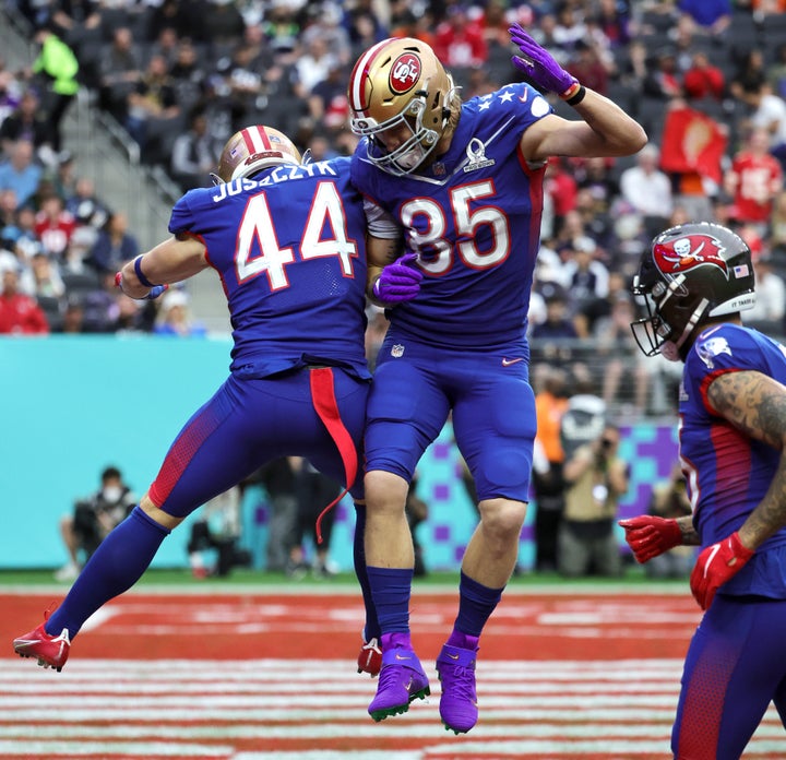 Kyle Juszczyk #44 of the San Francisco 49ers celebrates a touchdown with NFC and 49ers teammate George Kittle #85 in the 2022 NFL Pro Bowl.