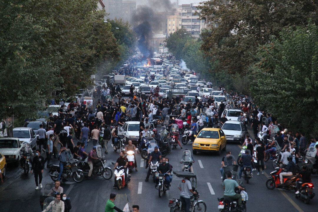 A picture obtained by AFP outside Iran on Sept. 21 shows Iranian demonstrators taking to the streets of the capital Tehran during a protest for Mahsa Amini, days after she died in police custody. 