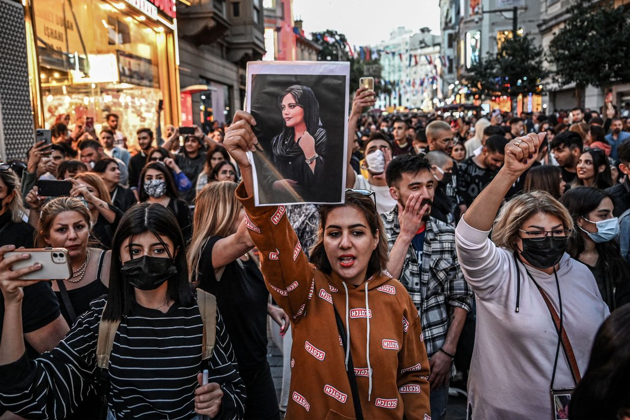 A protester holds a portrait of Mahsa Amini during a demonstration in support of Amini, who died after being arrested in Tehran by the Islamic Republic's morality police, on Istiklal Avenue in Istanbul on Sept. 20.