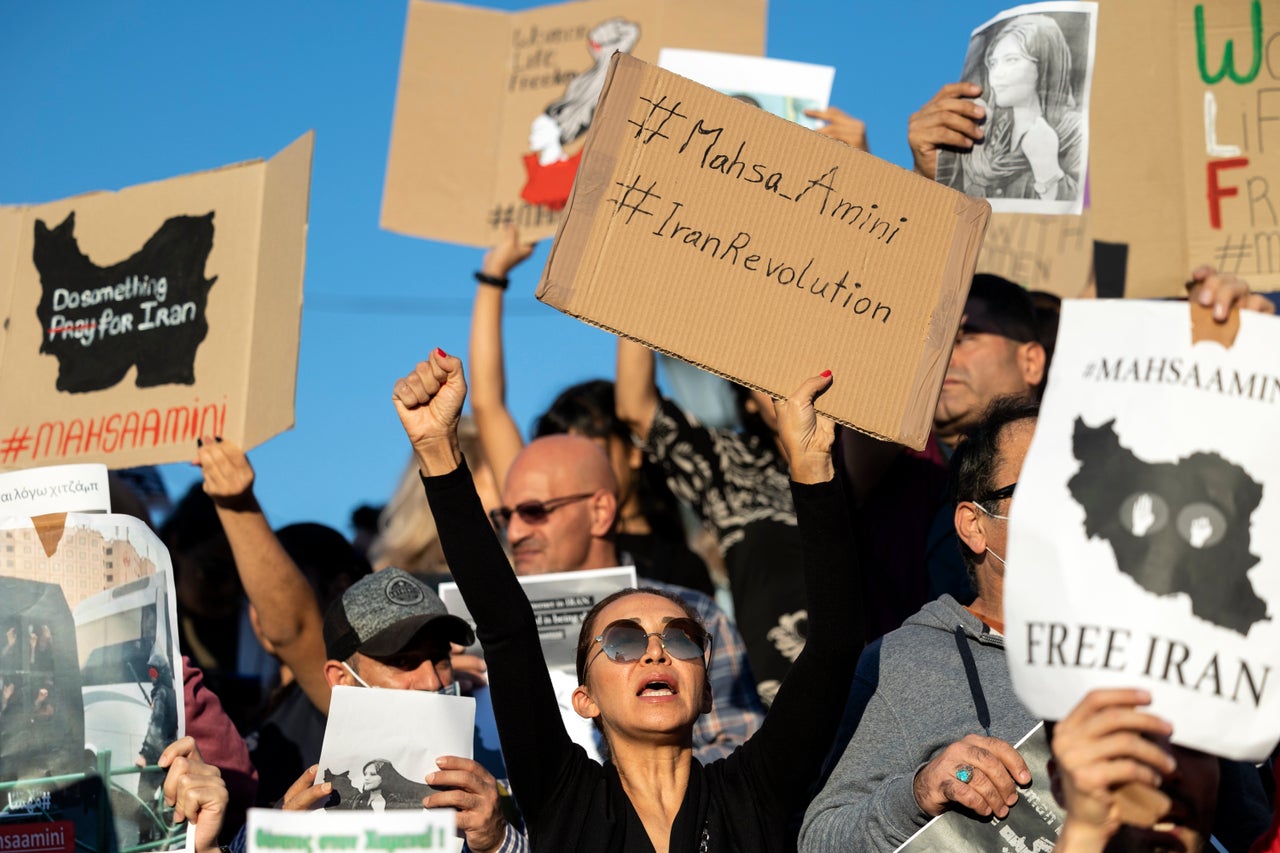 Protesters shout slogans Saturday during an Athens protest against the death of Iranian Mahsa Amini.