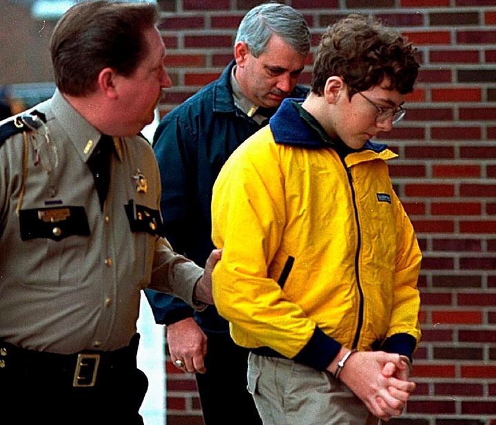 Carneal is seen escorted out of the McCracken County Courthouse after his arraignment in 1998.