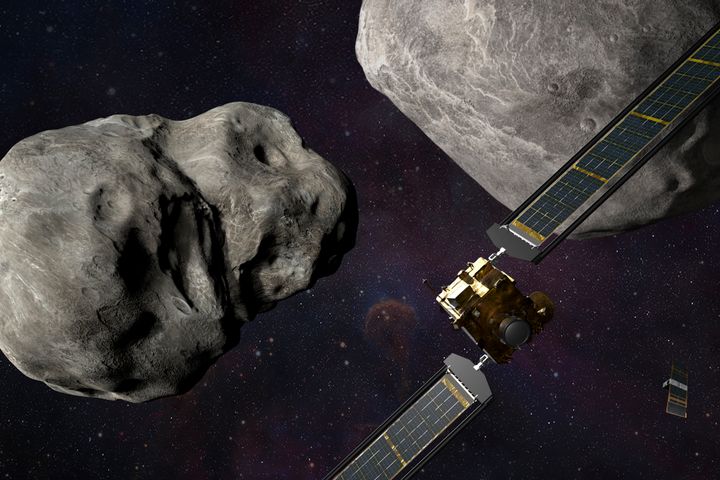 This illustration made available by Johns Hopkins APL and NASA depicts NASA's DART probe, foreground right, and Italian Space Agency's (ASI) LICIACube, bottom right, at the Didymos system before impact with the asteroid Dimorphos, left. DART is expected to zero in on the asteroid Monday, Sept. 26, 2022, intent on slamming it head-on at 14,000 mph. The impact should be just enough to nudge the asteroid into a slightly tighter orbit around its companion space rock. (Steve Gribben/Johns Hopkins APL/NASA via AP)