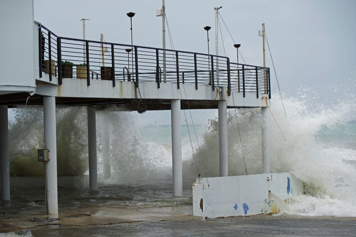 Waves crash against the patio of Lobster Pot restaurant as Hurricane Ian passes through George Town, Grand Cayman island, on Monday.