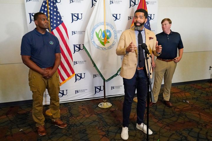 Jackson Mayor Chokwe Antar Lumumba is seen during a news briefing earlier this month with EPA Administrator Michael Regan, left, and Mississippi Gov. Tate Reeves (R), right. Lumumba said he's open to receiving federal assistance.