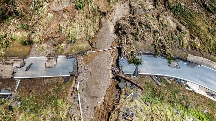 A damaged road is seen on Sept. 20 in Toa Alta, Puerto Rico, following flooding caused by Hurricane Fiona.