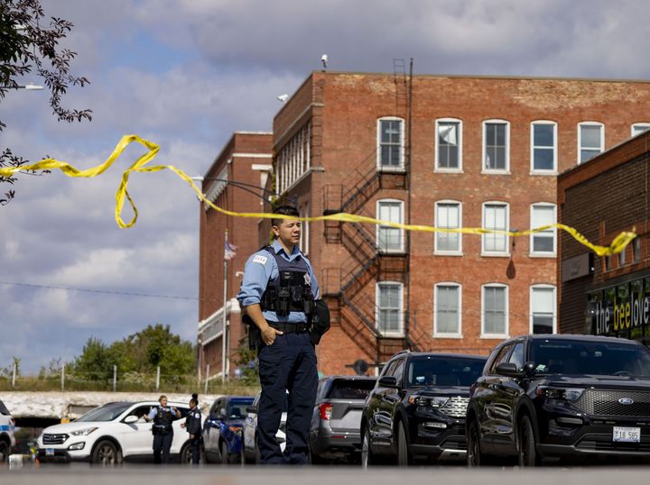 Crime scene tape breaks as Chicago police close the street at the scene of a shooting at the Chicago Police Department Homan Square evidence facility on Sept. 26, 2022.