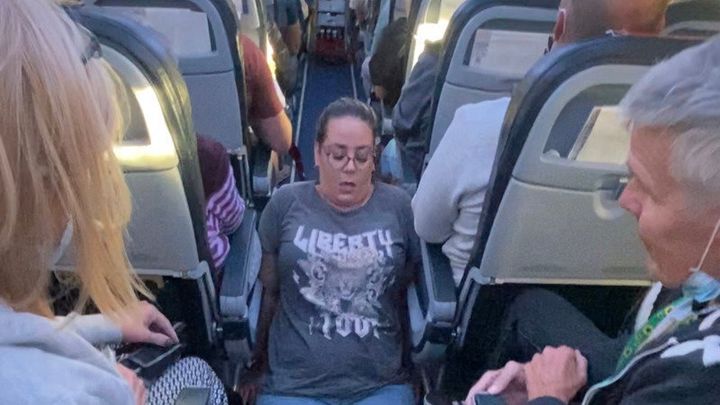 Jennie Berry had to drag herself through the aisle on a recent flight. 