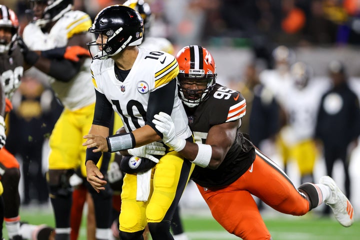 Cleveland Browns defensive end Myles Garrett (95) hits Pttsburgh Steelers quarterback Mitch Trubisky (10) in a Sept. 22, 2022 game.