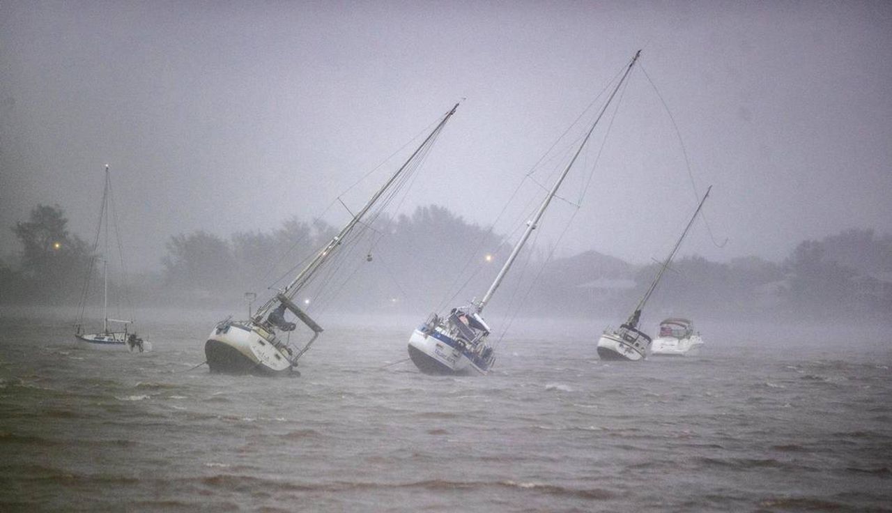 Sailboats anchored in Roberts Bay are blown around by 50 mph winds in Venice as Hurricane Ian approaches the western coast of Florida on Wednesday.