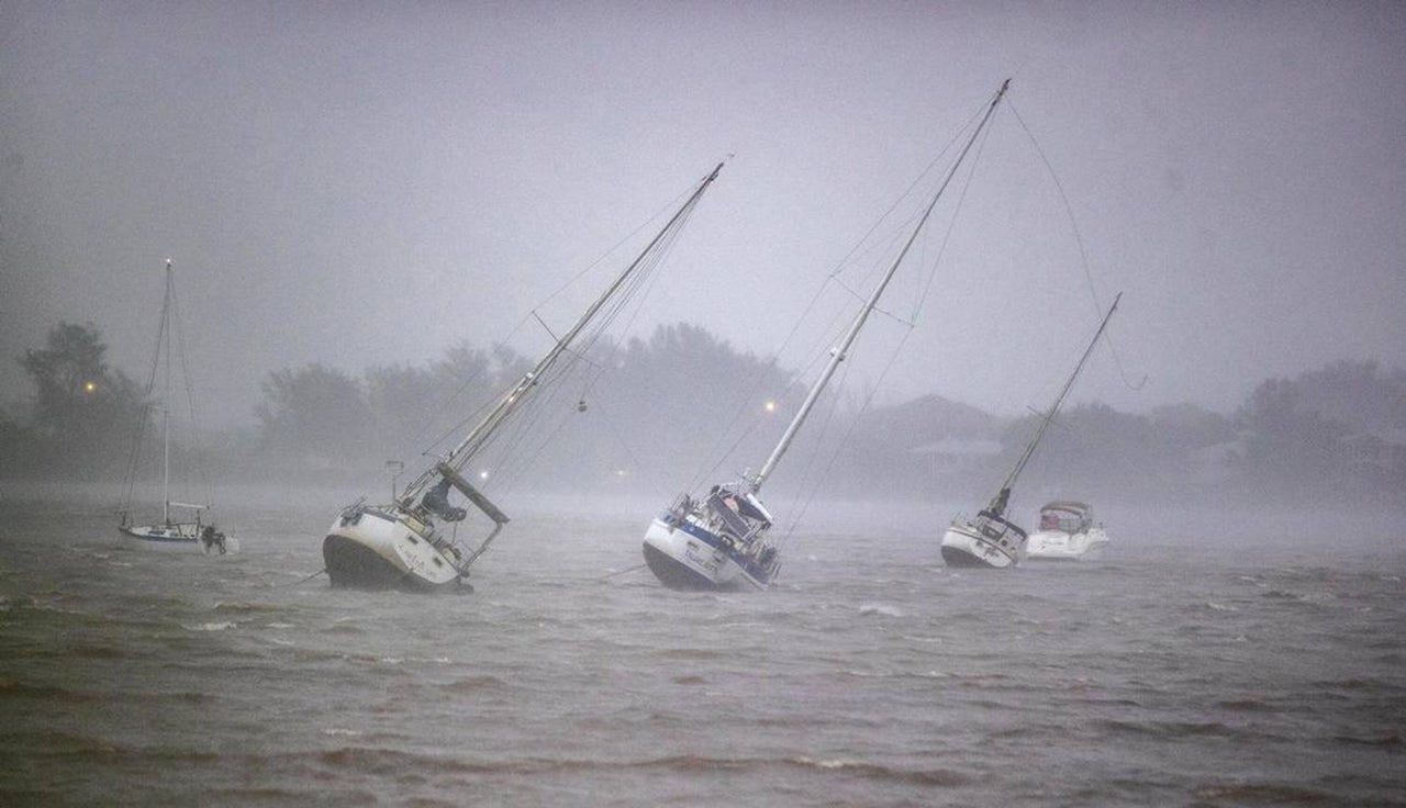 Sail boats anchored in Roberts Bay are blown around by 50 mph winds in Venice, Florida, as Hurricane Ian approaches on Wednesday.