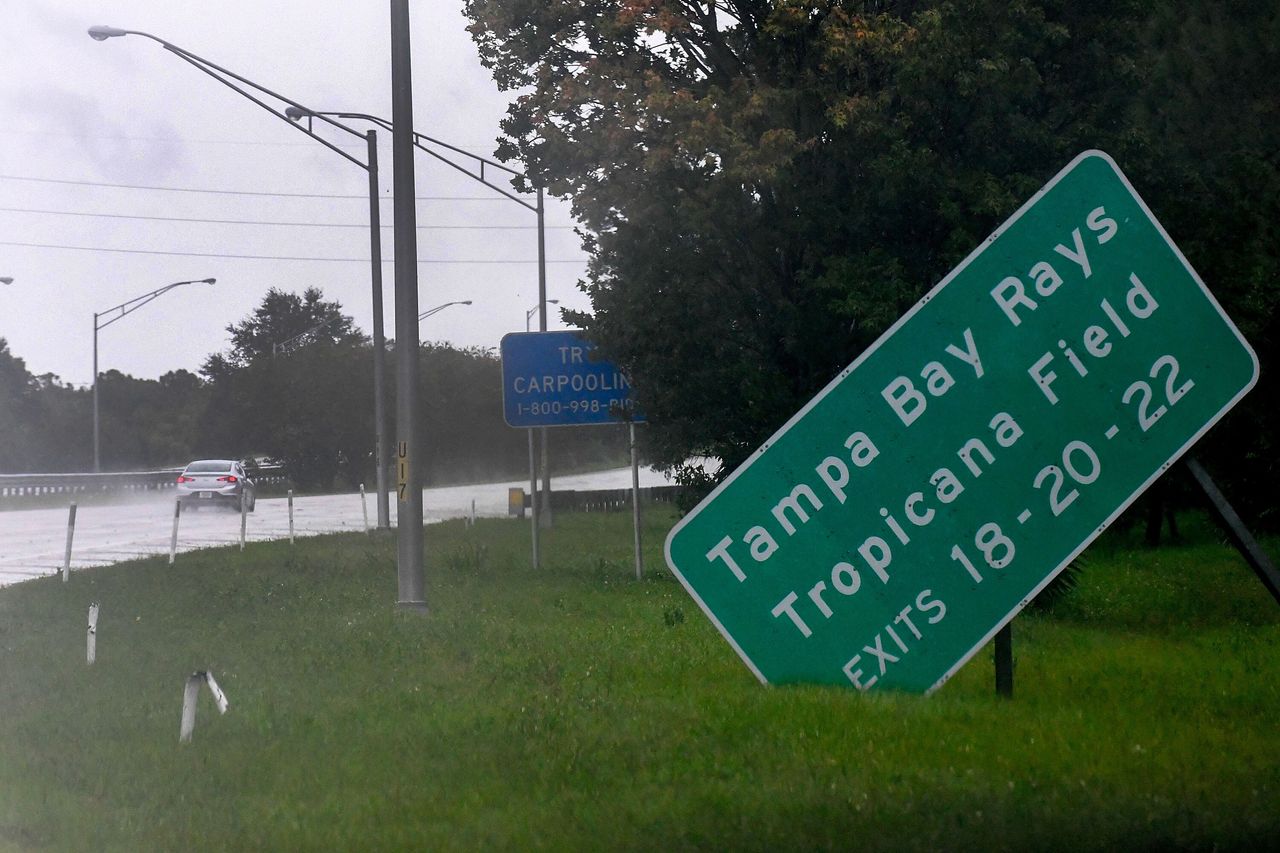 A damaged sign sits on the side of state road I-275 as Hurricane Ian approaches Wednesday in St. Petersburg.