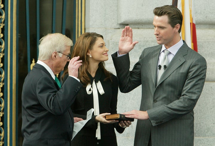 Gavin Newsom takes the mayoral oath in San Francisco with then wife Kimberly Guilfoyle Newsom in 2004.
