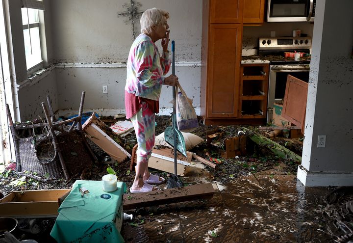 Stedi Scuderi looks over her Fort Myers apartment Thursday morning after flood water inundated it when Hurricane Ian passed through the area. The hurricane brought high winds, storm surge and rain to the area causing severe damage.