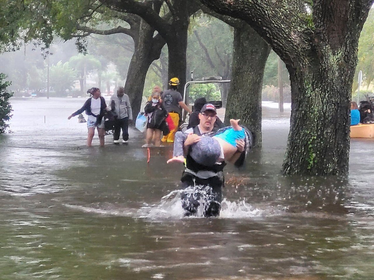 Orange County Fire Rescue's firefighters help people stranded by Hurricane Ian early Thursday.