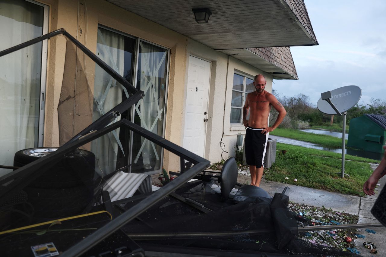 Shawn Hulbert, 38, stands outside his damaged home in the aftermath of Hurricane Ian in Punta Gorda on Thursday.