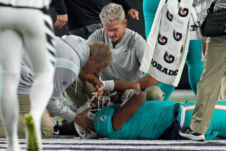 Miami Dolphins quarterback Tua Tagovailoa is examined during the first half of the team's NFL football game Thursday against the Bengals in Cincinnati.