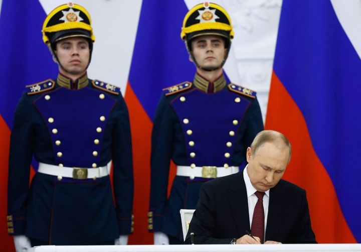 Russian President Vladimir Putin signs treaties formally annexing four regions of Ukraine Russian troops occupy - Lugansk, Donetsk, Kherson and Zaporizhzhia, at the Kremlin in Moscow on Sept. 30, 2022. 