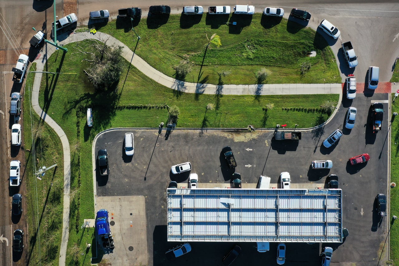 In this aerial view, vehicles line up to purchase gasoline in the wake of Hurricane Ian on Sept. 30 in Port Charlotte. 